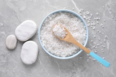 Photo of Flat lay composition with white sea salt on marble background. Spa treatment