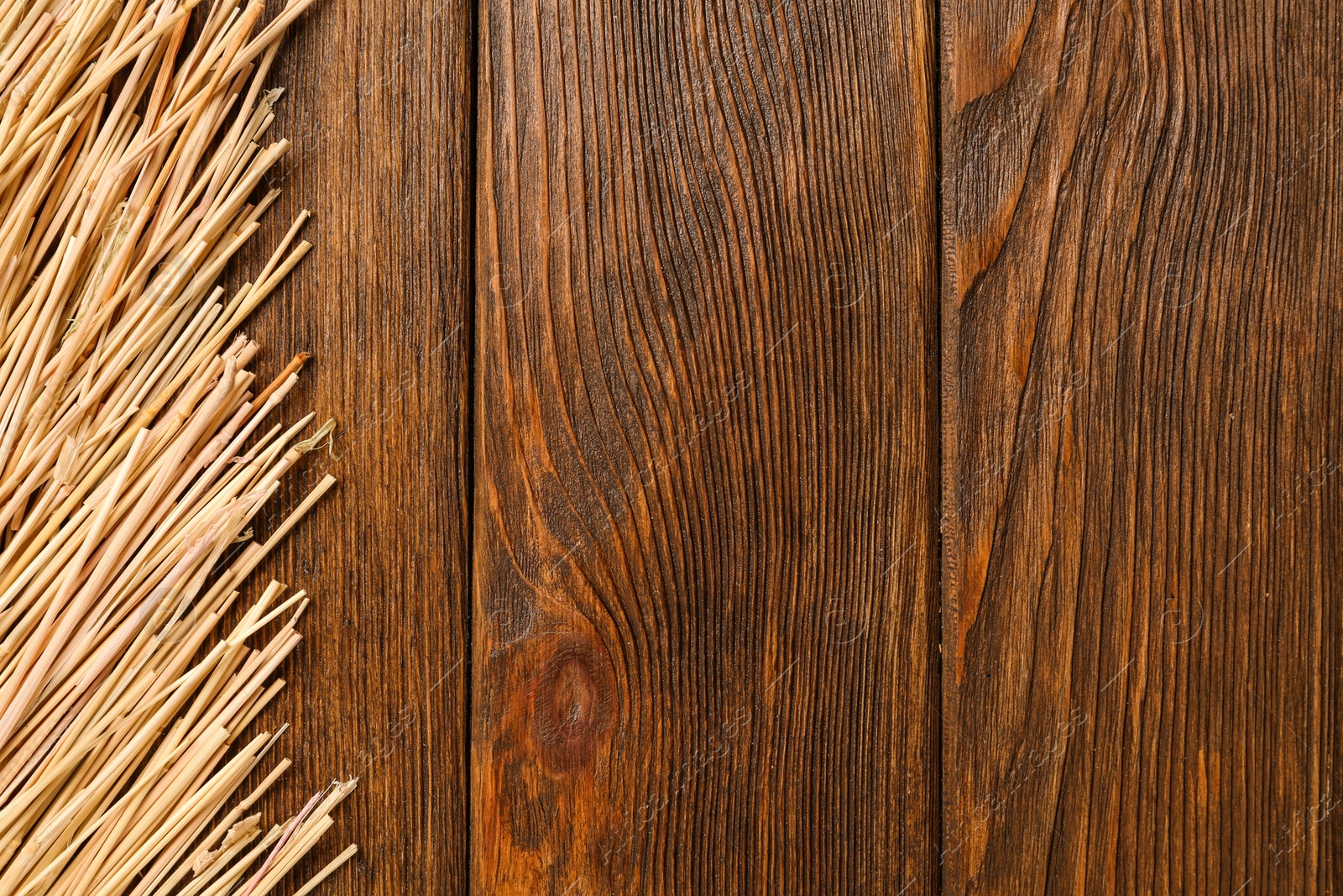 Photo of Dried hay on wooden background, flat lay. Space for text