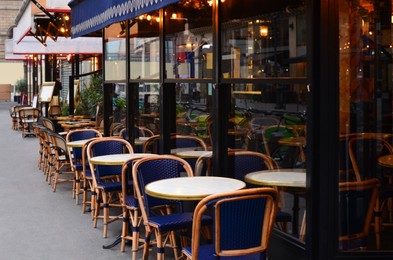 Outdoor cafe with rattan chairs and tables