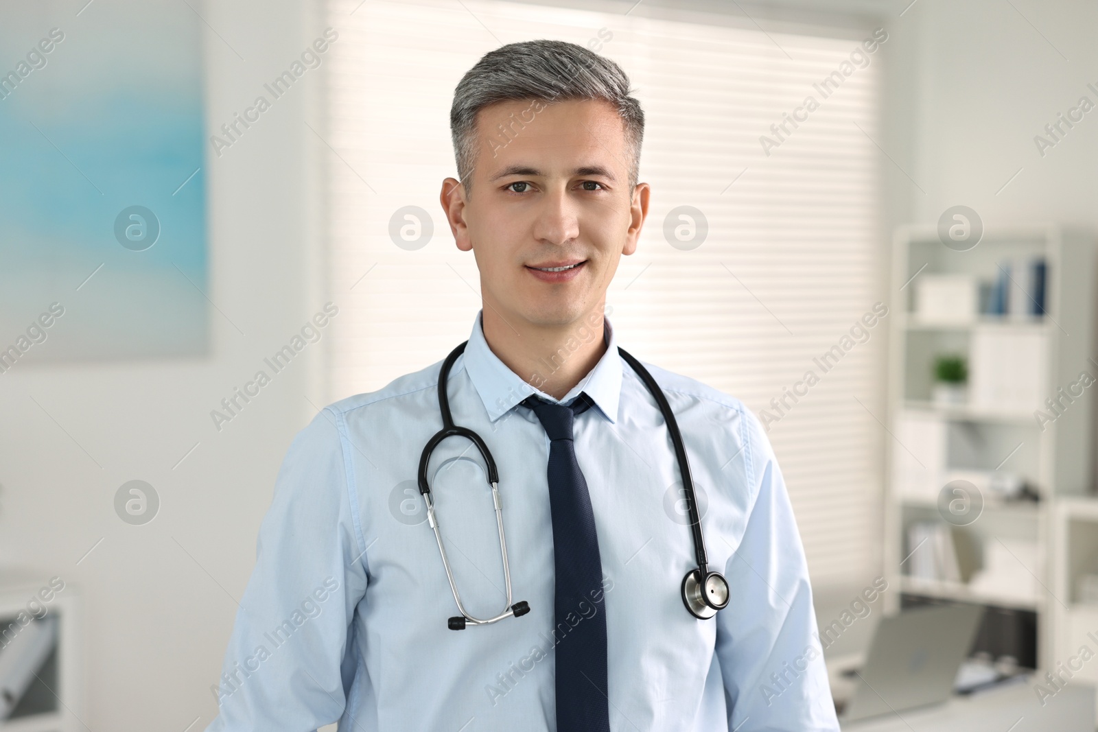 Photo of Portrait of doctor with stethoscope in clinic