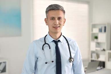 Portrait of doctor with stethoscope in clinic