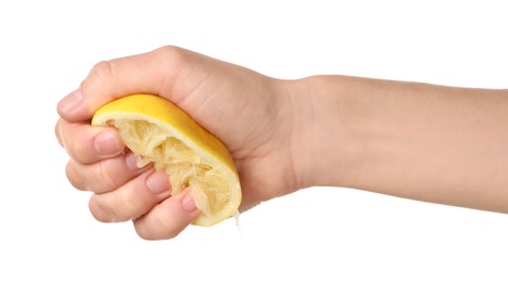 Photo of Woman squeezing lemon half on white background, closeup