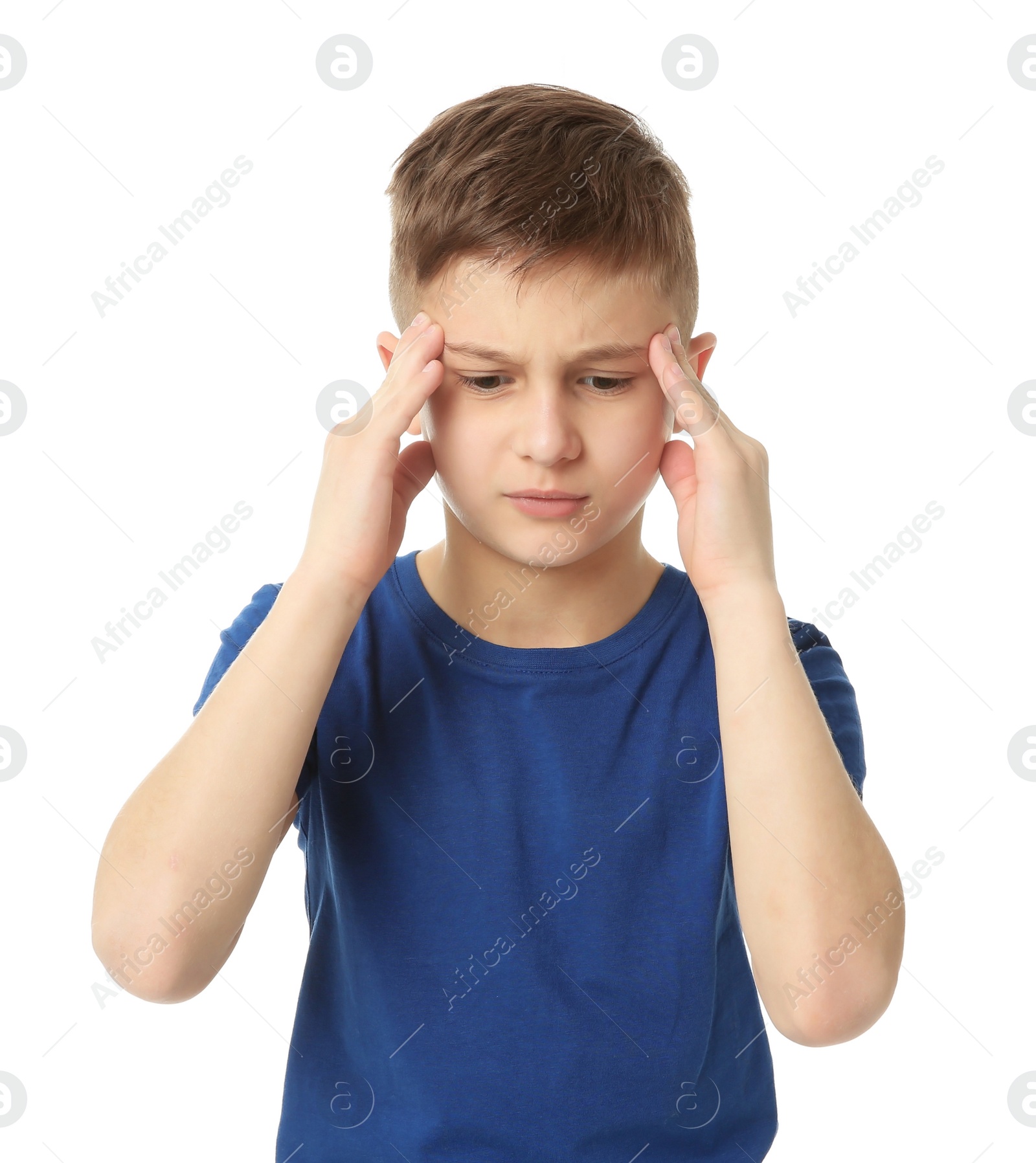 Photo of Little boy suffering from headache on white background