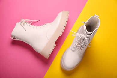 Pair of stylish leather shoes on color background, flat lay