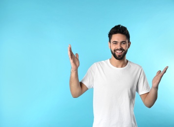 Photo of Portrait of happy young man on color background. Space for text