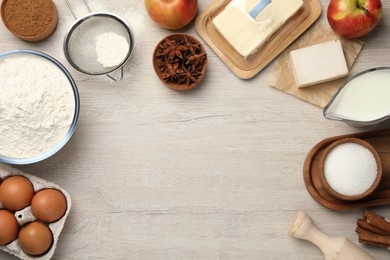 Photo of Flat lay composition with flour and different ingredients on white wooden table, space for text. Cooking yeast cake
