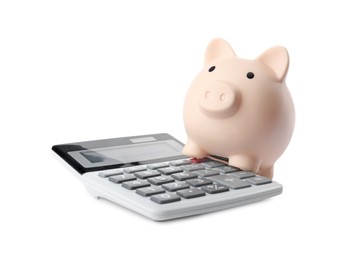 Calculator and piggy bank isolated on white