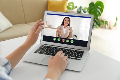 Image of Coworkers working together online. Woman using video chat on laptop, closeup