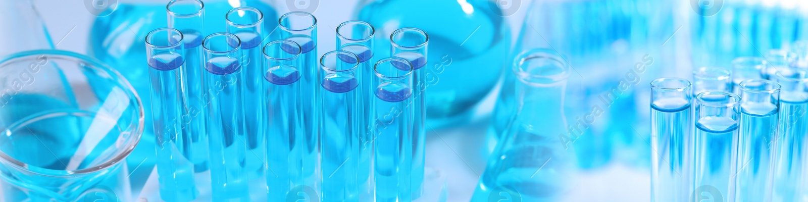 Image of Chemistry and chemical research. Collage of different laboratory glassware with liquids, blue tone effect. Banner design