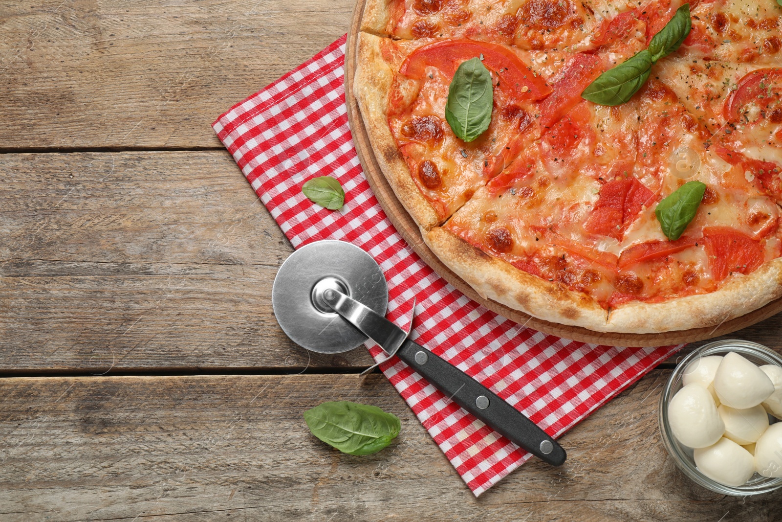 Photo of Delicious pizza Margherita on wooden table, flat lay