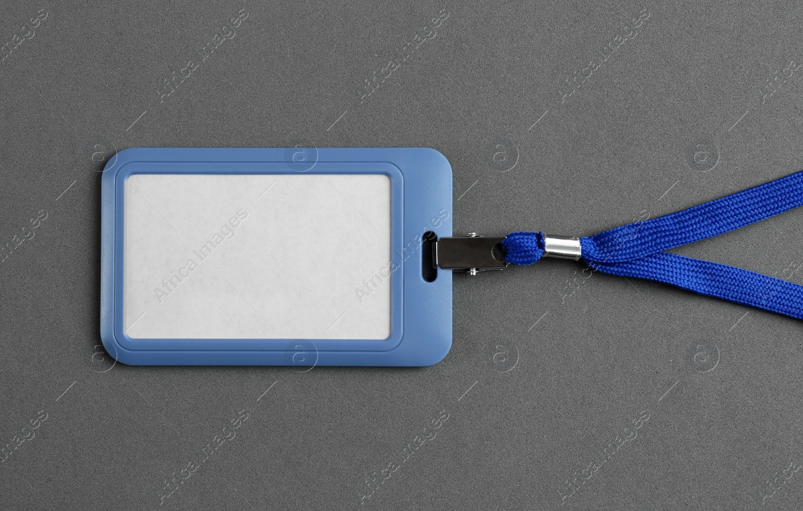 Photo of Blank badge on grey background, top view. Mockup for design