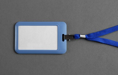 Photo of Blank badge on grey background, top view. Mockup for design