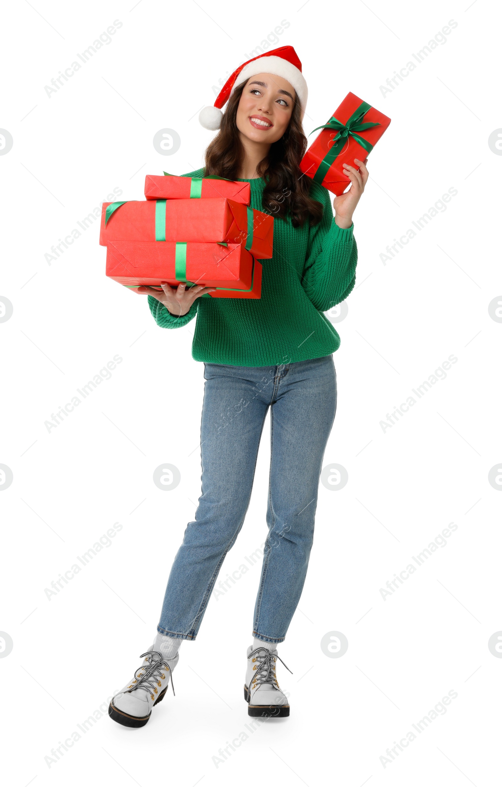 Photo of Beautiful young woman in Santa hat with Christmas gifts isolated on white