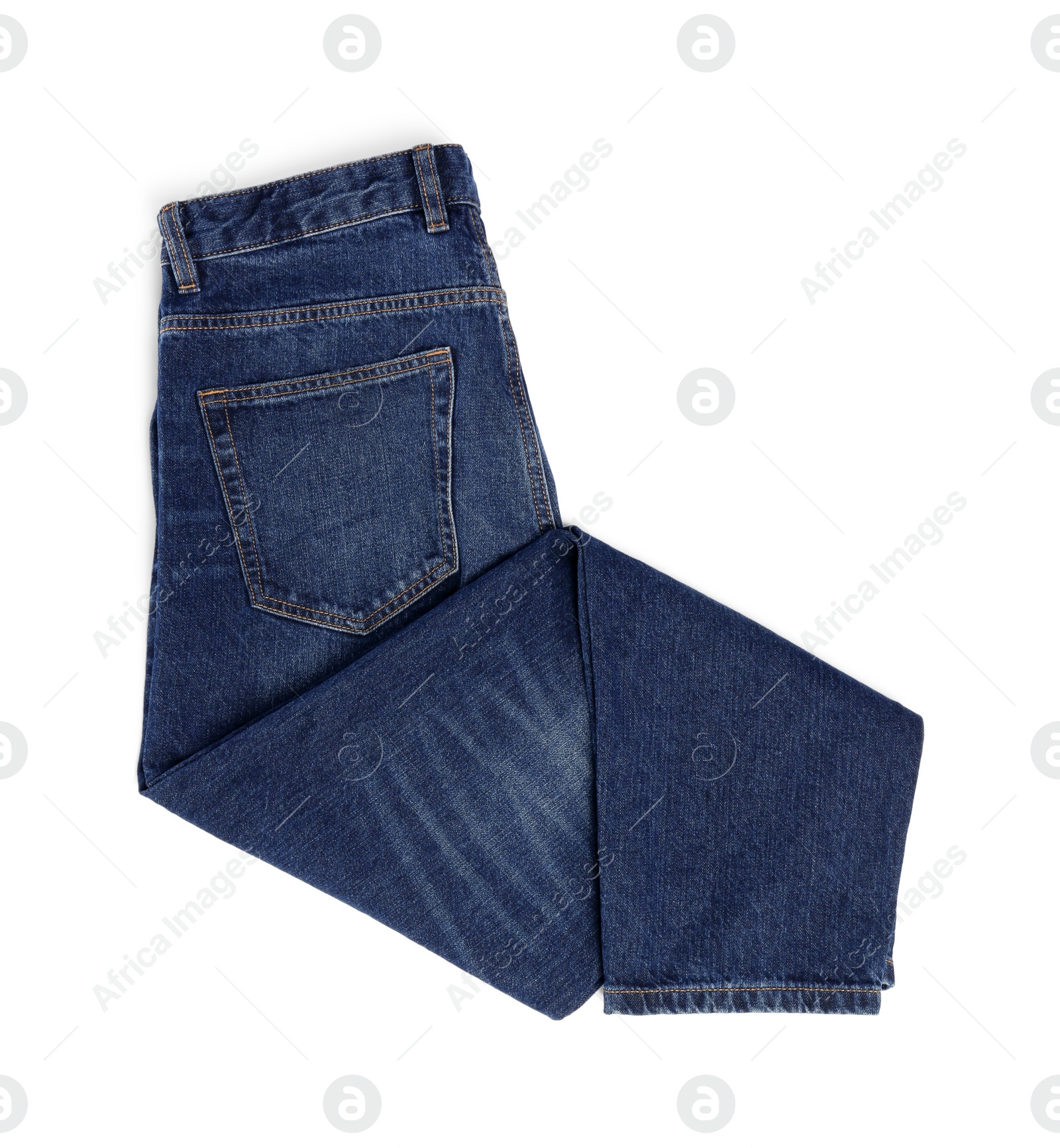 Photo of Folded dark blue jeans isolated on white, top view