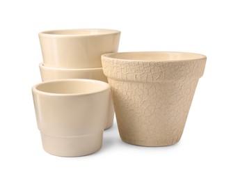 Photo of Different empty ceramic flower pots on white background