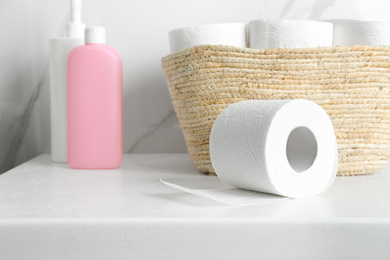 Photo of Toilet paper rolls on countertop in bathroom