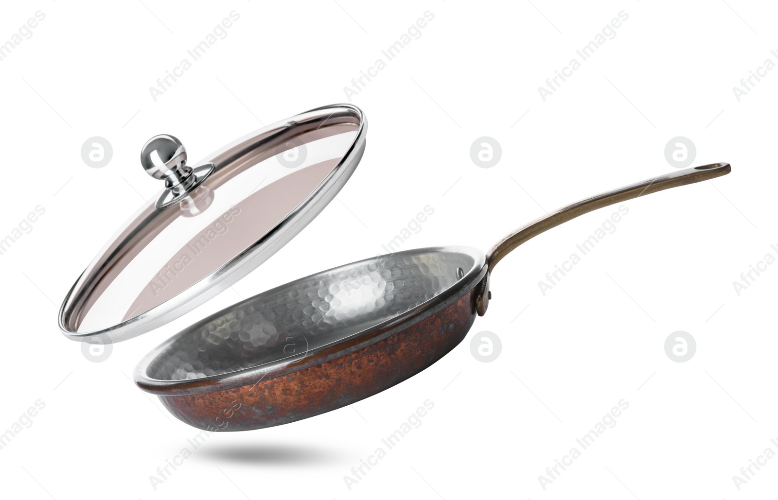 Image of New frying pan and glass lid on white background