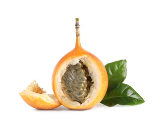 Cut delicious granadilla with leaves isolated on white