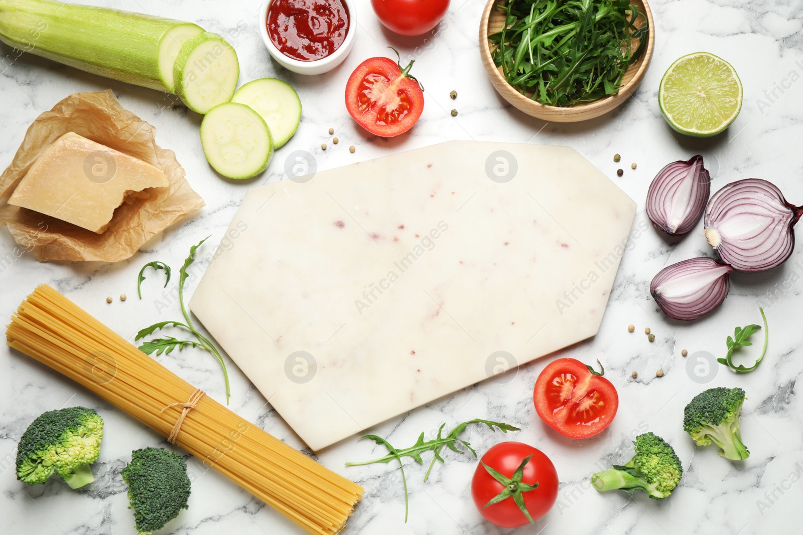 Photo of Flat lay composition with fresh products on marble table, space for text. Healthy cooking