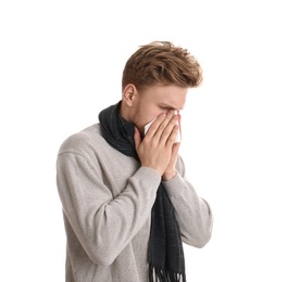 Photo of Handsome young man blowing nose against white background