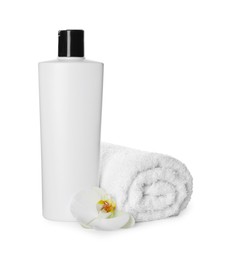Bottle of shampoo and terry towel on white background