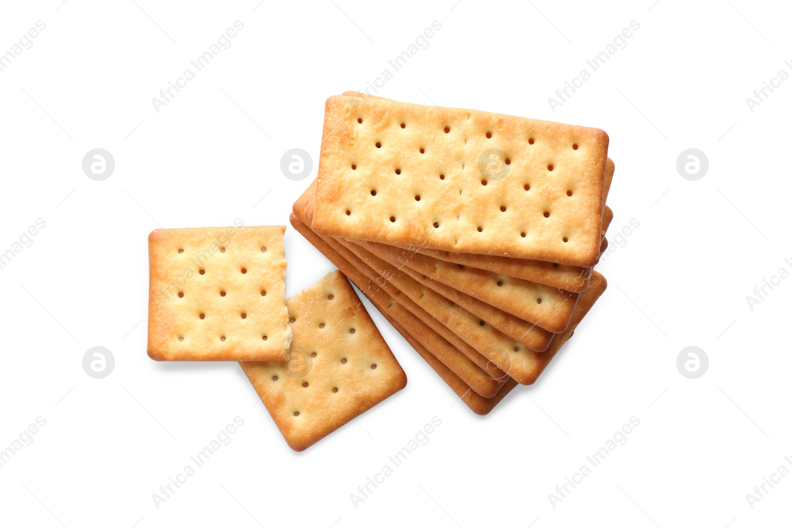 Photo of Stack of delicious crispy crackers isolated on white, top view