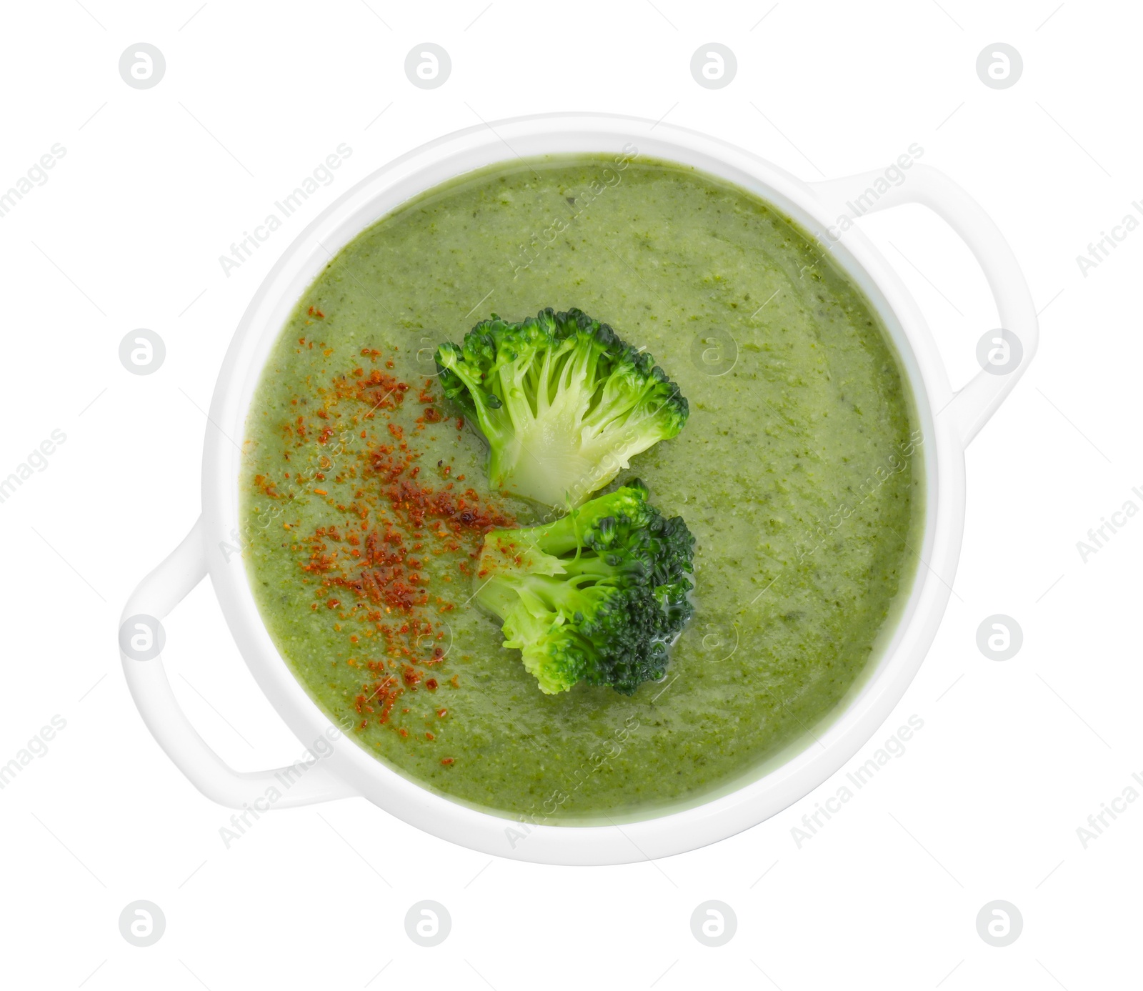 Photo of Delicious broccoli cream soup in bowl isolated on white, top view