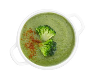 Photo of Delicious broccoli cream soup in bowl isolated on white, top view