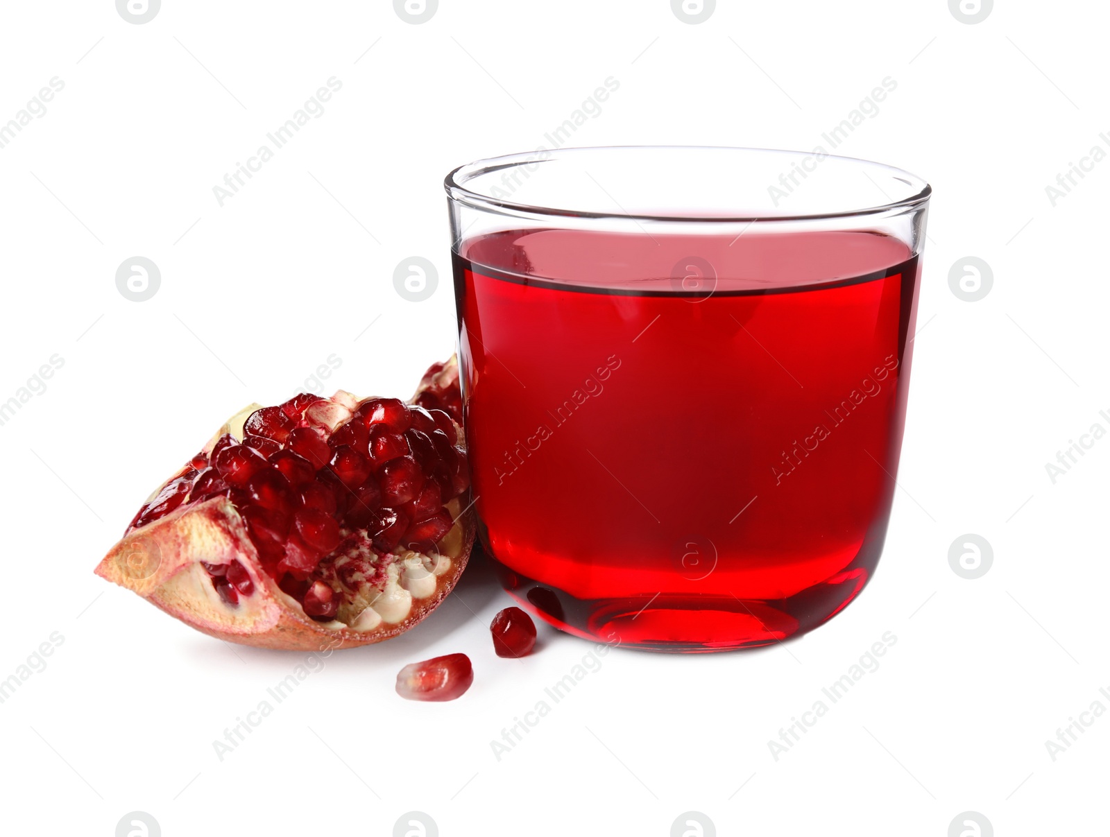 Photo of Freshly made pomegranate juice in glass on white background