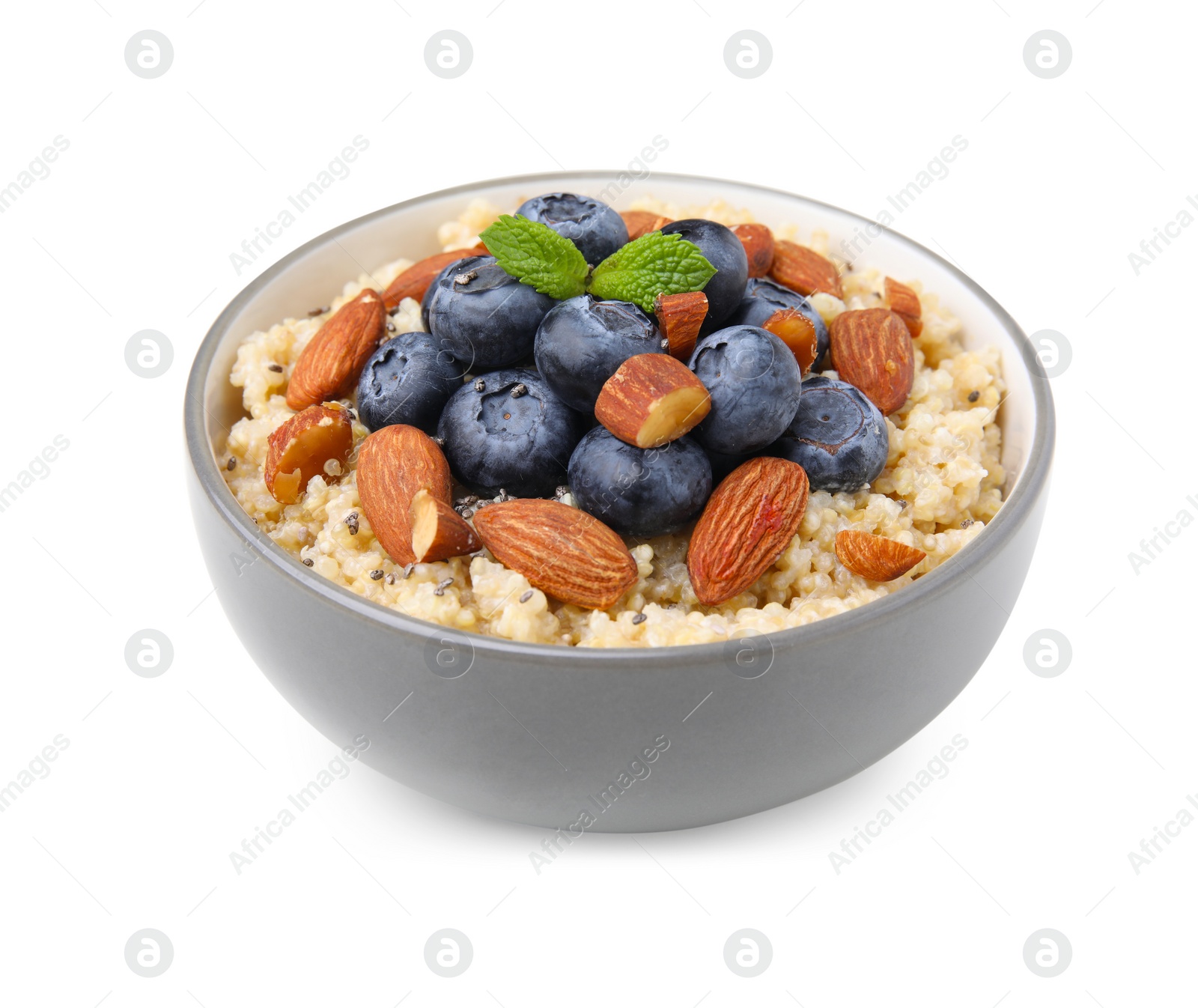 Photo of Bowl of delicious cooked quinoa with almonds and blueberries isolated on white