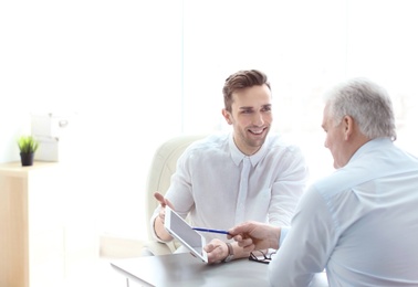 Human resources manager conducting job interview with applicant in office