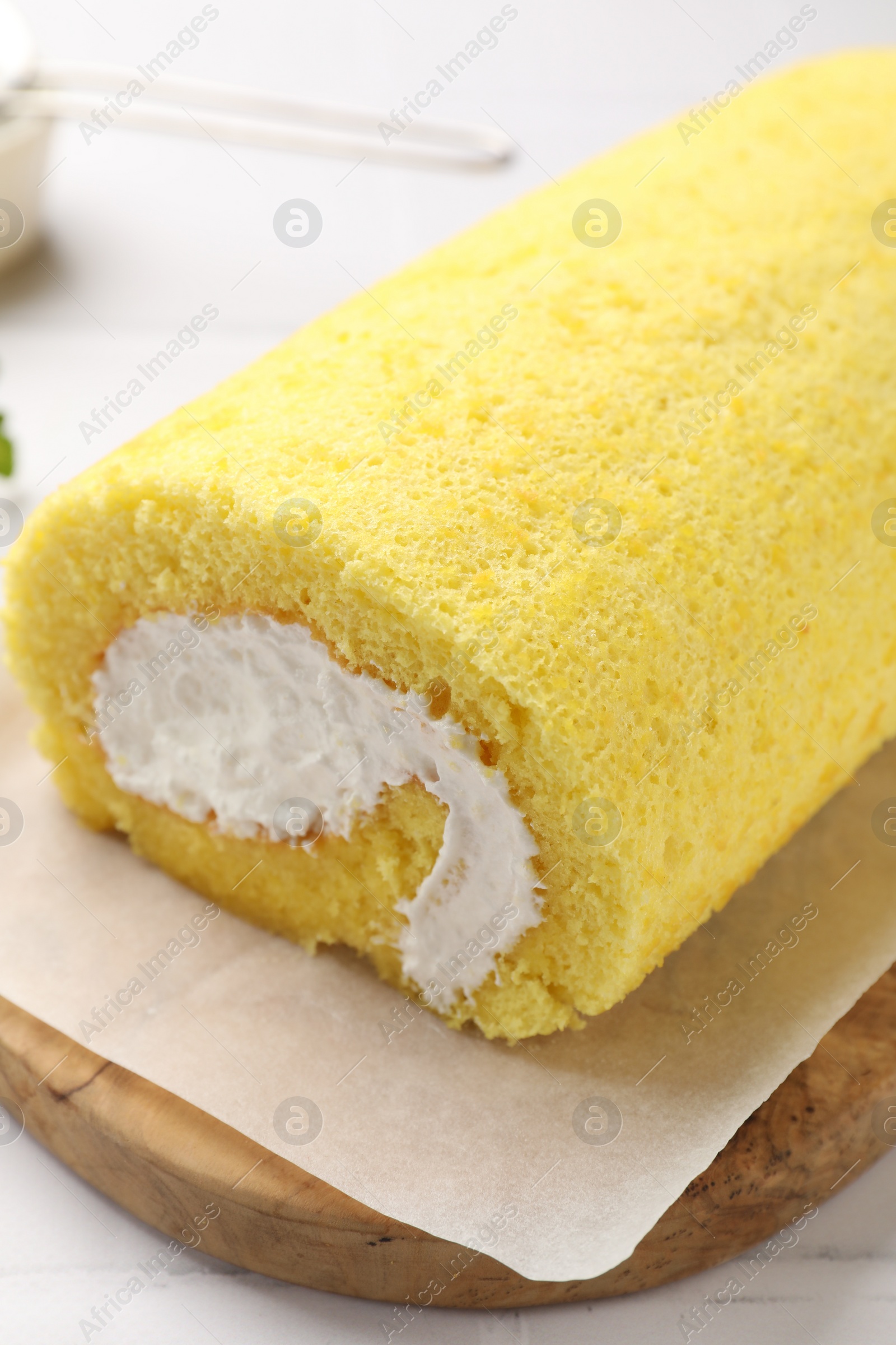 Photo of Delicious cake roll on table, closeup view