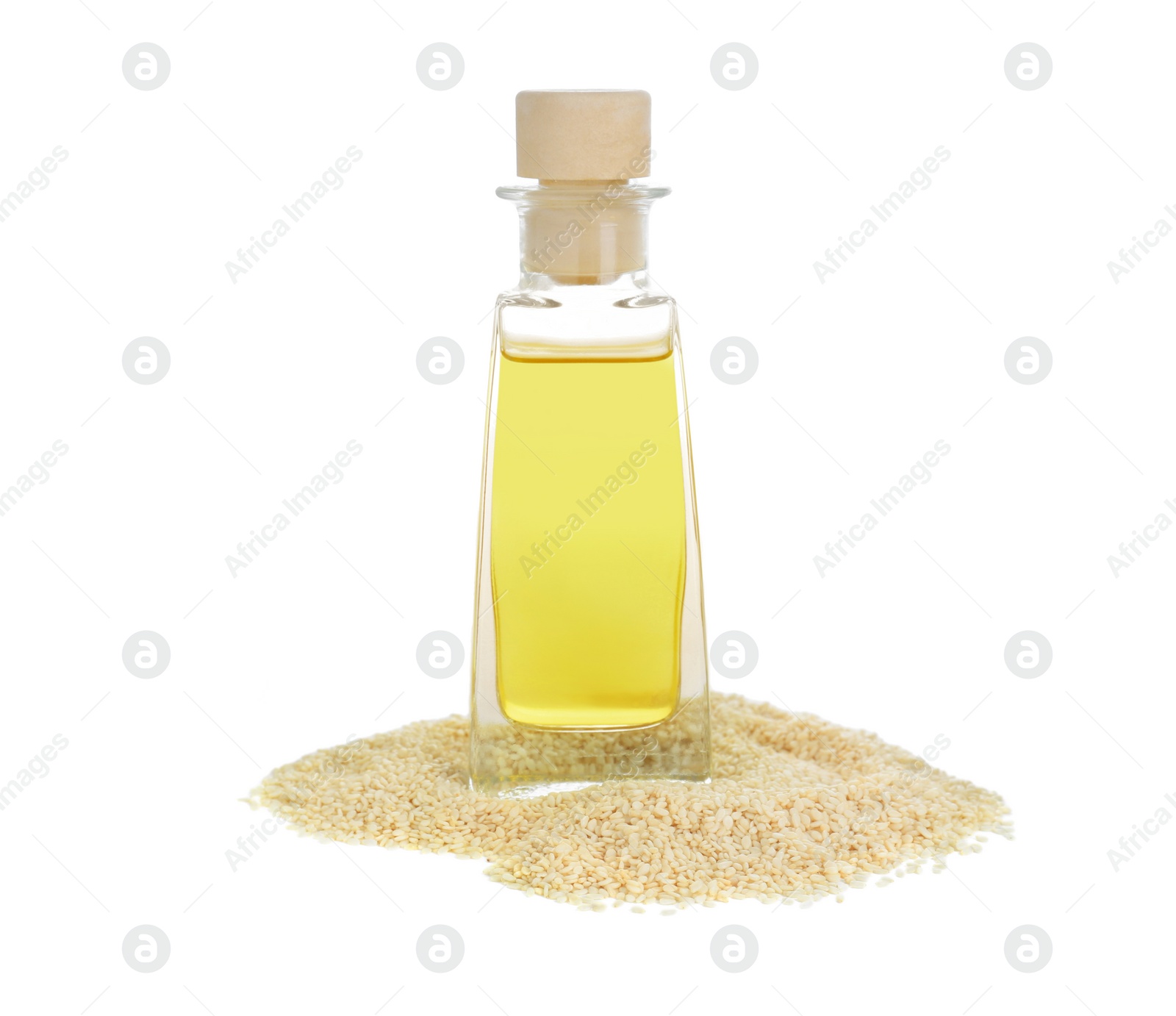 Photo of Glass bottle with fresh sesame oil and seeds isolated on white