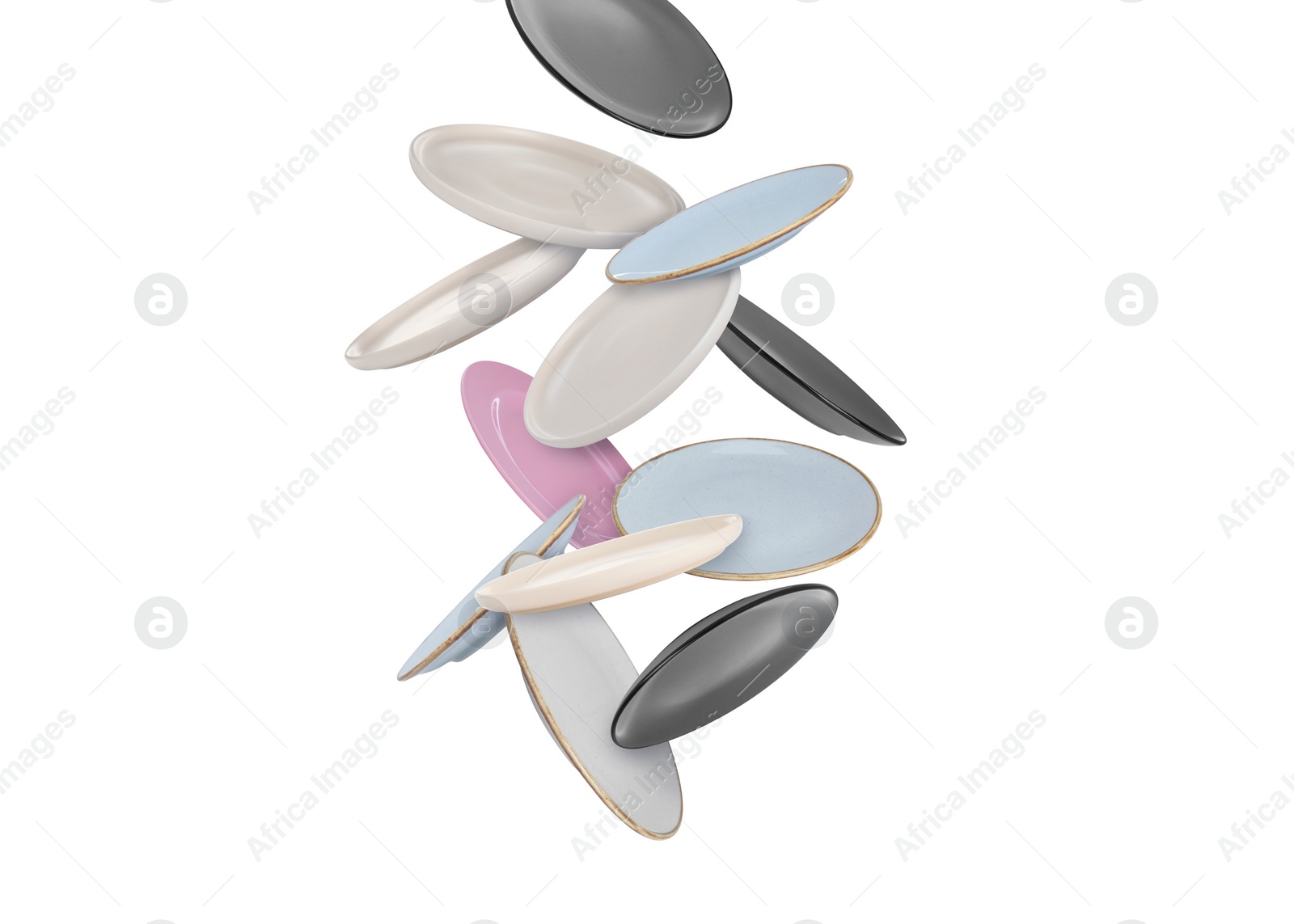 Image of Many different plates falling on white background