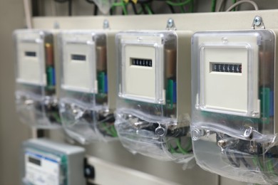 Photo of Electric meters and wires in fuse box, closeup