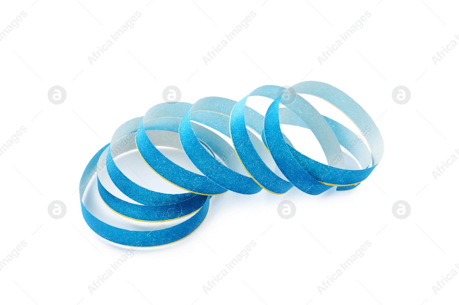 Photo of Light blue serpentine streamer on white background. Festive decor