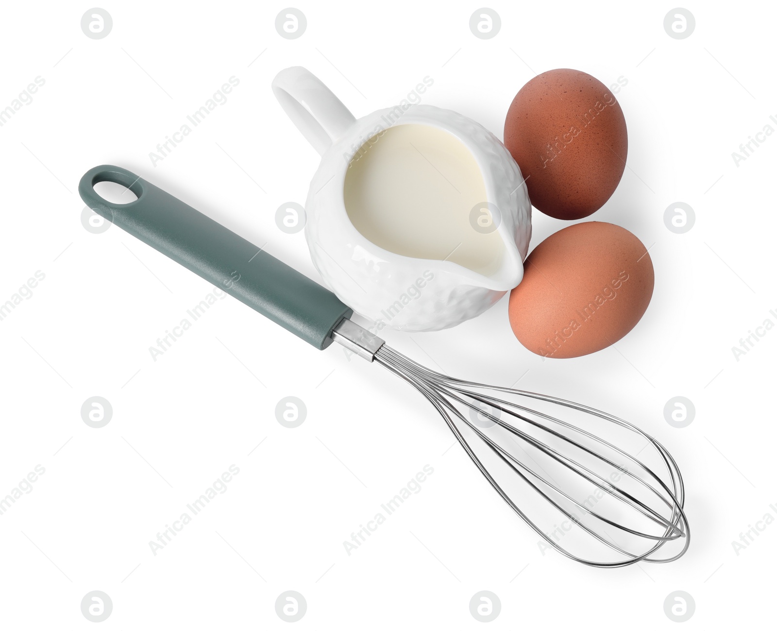 Photo of Whisk, raw eggs and jug of milk isolated on white, above view