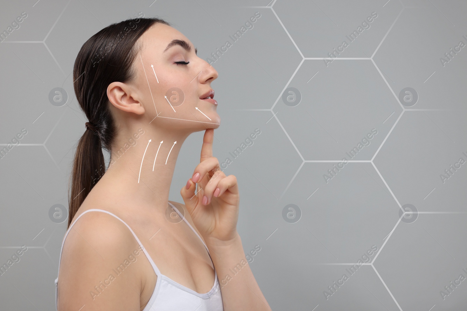 Image of Woman with perfect skin after cosmetic treatment on grey background, space for text. Lifting arrows on her neck and face