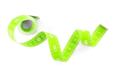 New green measuring tape isolated on white, top view