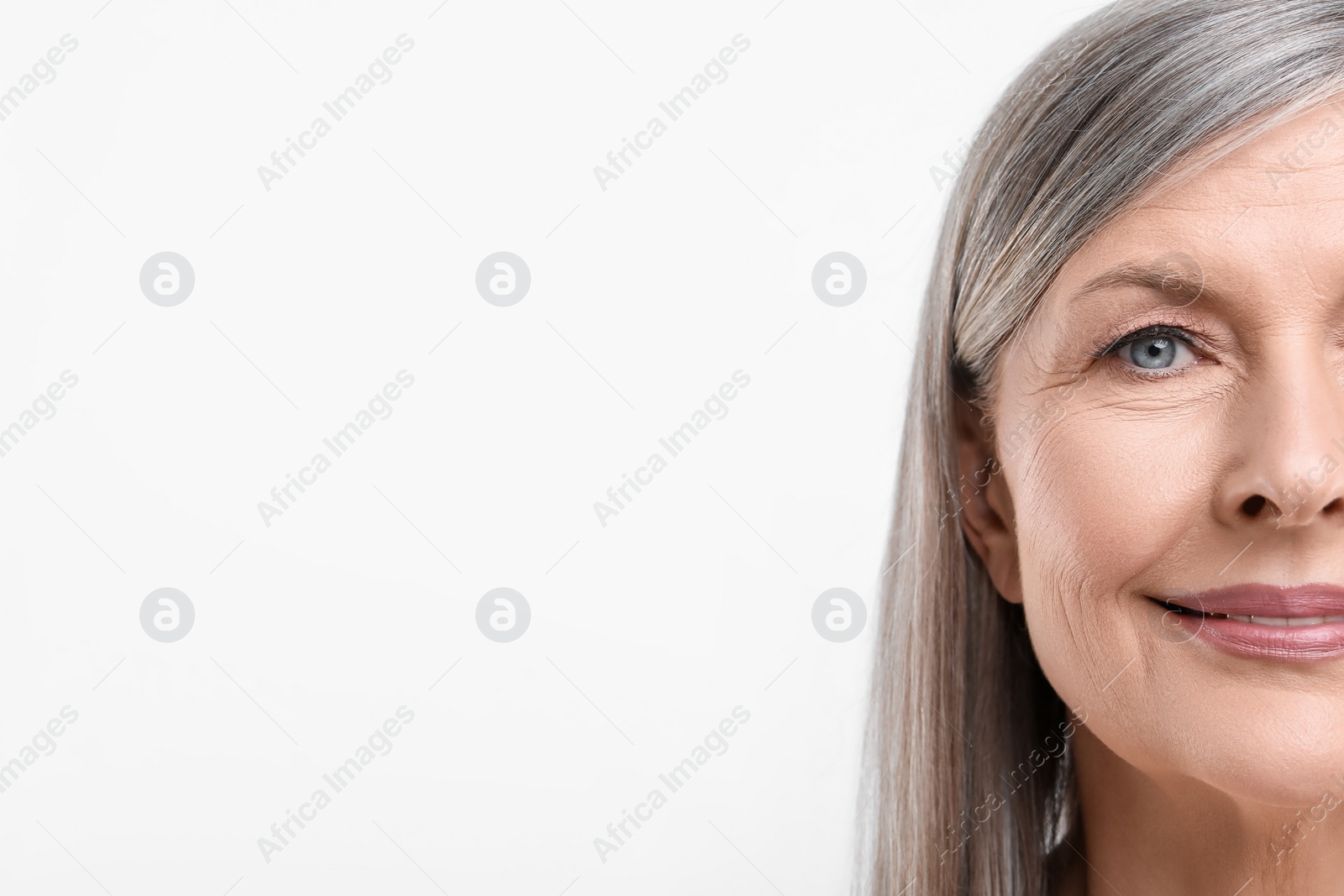 Photo of Portrait of beautiful senior woman on white background, closeup. Space for text