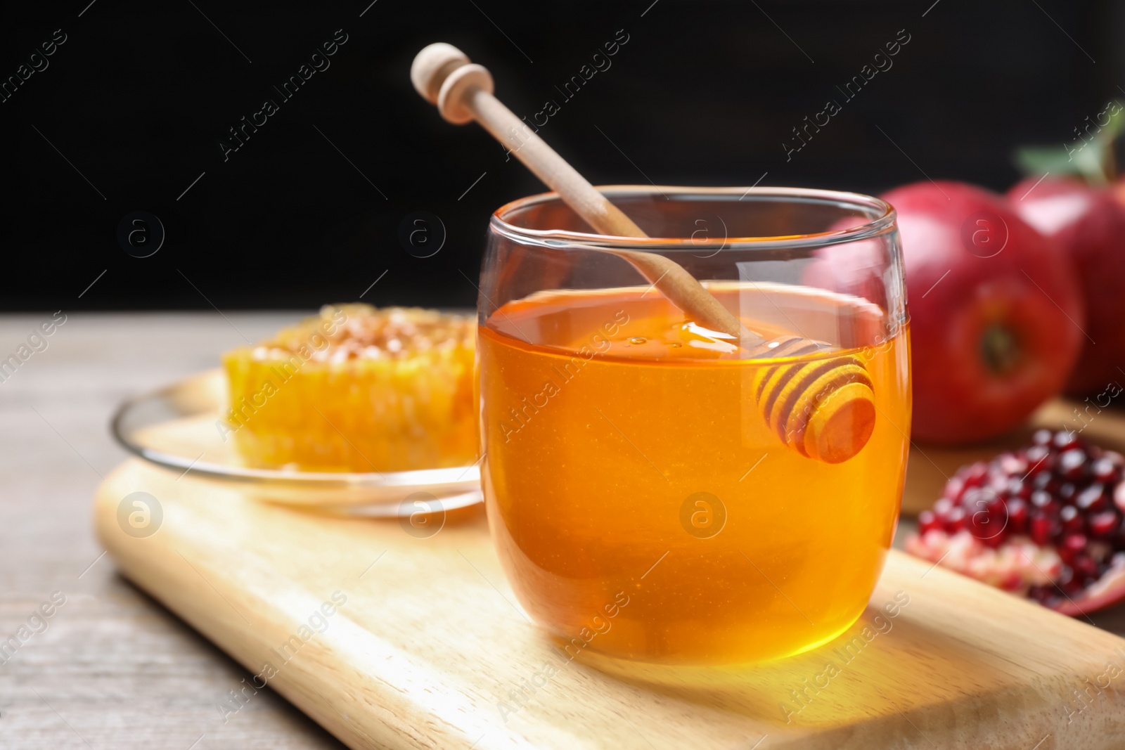 Photo of Honey, apples and pomegranate on table. Rosh Hashanah holiday