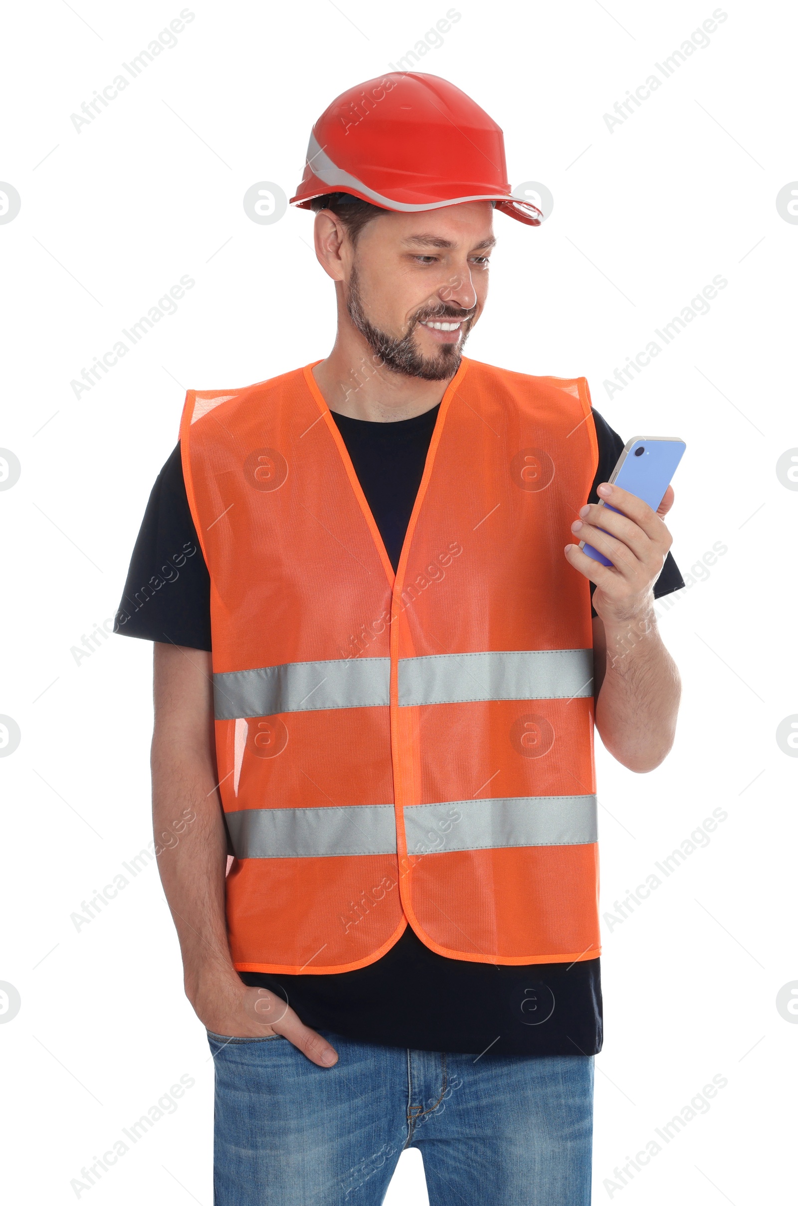 Photo of Male industrial engineer in uniform with phone on white background