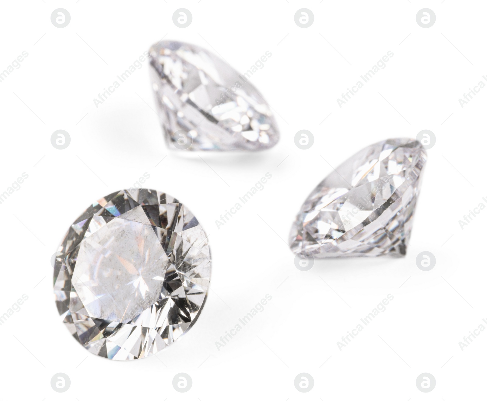 Photo of Three beautiful shiny diamonds isolated on white