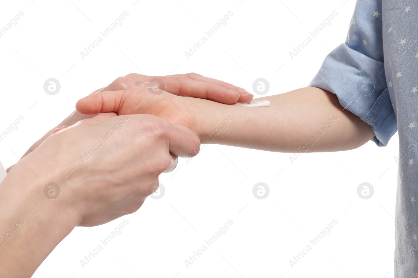 Photo of Mother applying ointment on her daughter's hand against white background, closeup