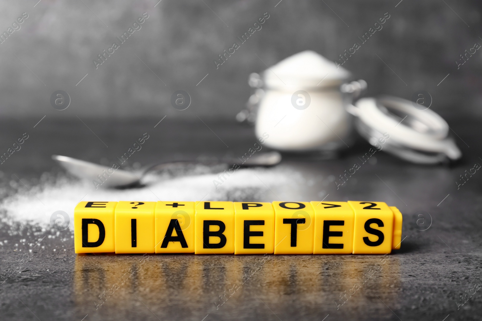 Photo of Word DIABETES made of cubes on table