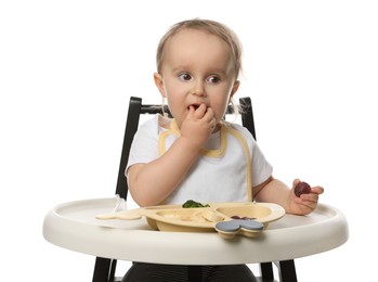 Cute little baby wearing bib while eating on white background