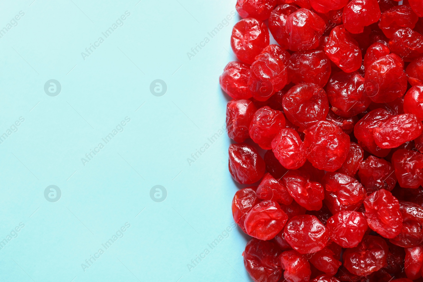 Photo of Cherries on color background, top view with space for text. Dried fruit as healthy snack