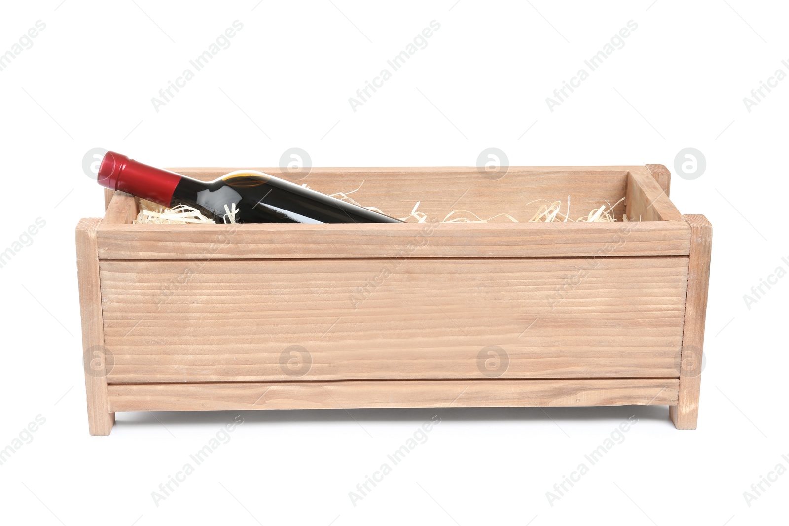 Photo of Open wooden crate with bottle of wine isolated on white