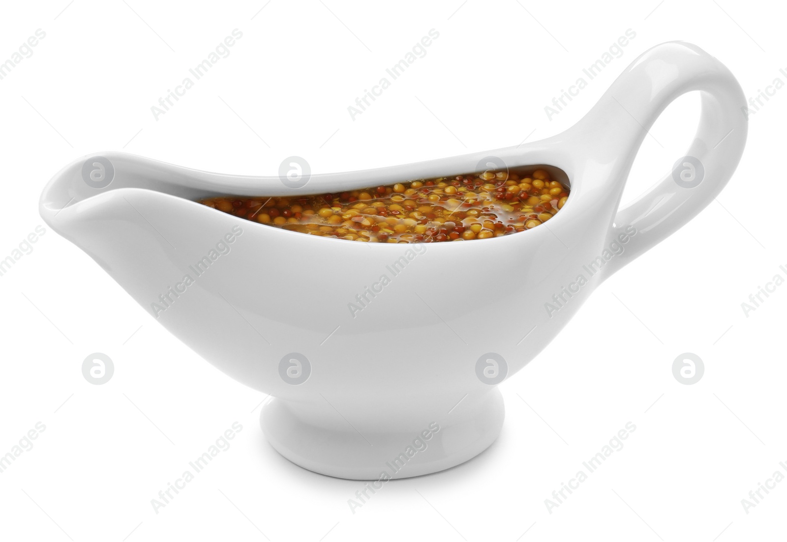 Photo of Ceramic boat with whole grain mustard sauce isolated on white