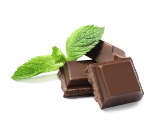 Pieces of milk chocolate with mint on white background